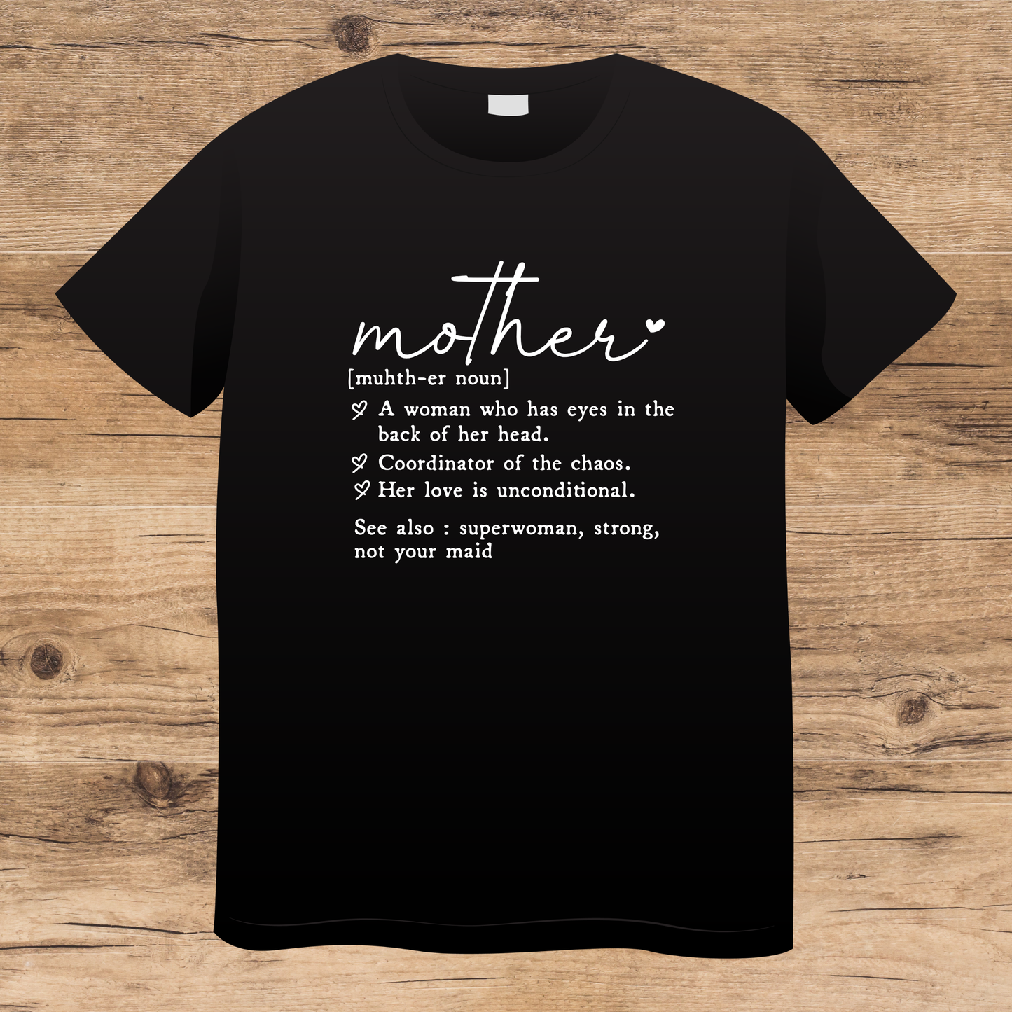 Black t-shirt with white text about mother on a wooden surface