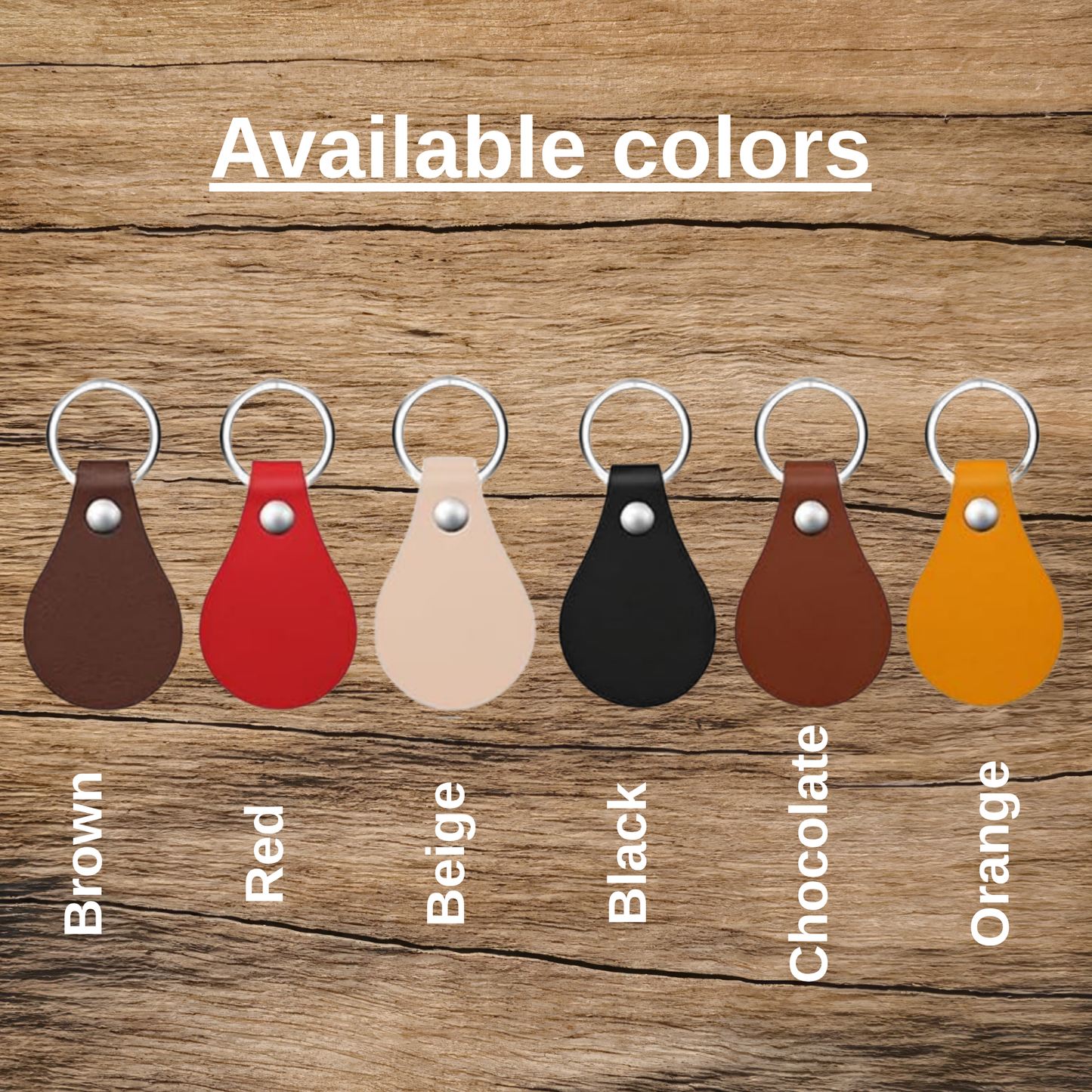 Set of leather keychains in various colors on a wooden background