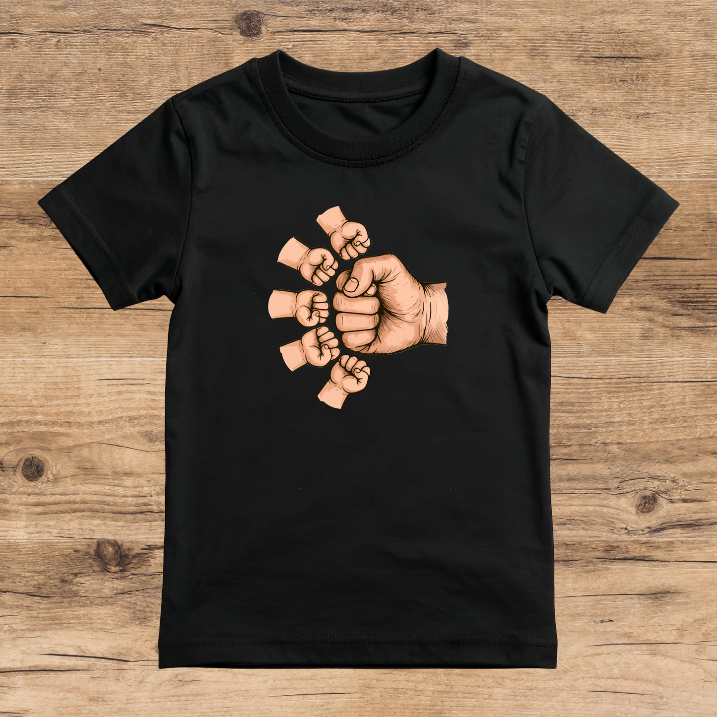 Black t-shirt with a graphic of interlocked hands on a wooden surface