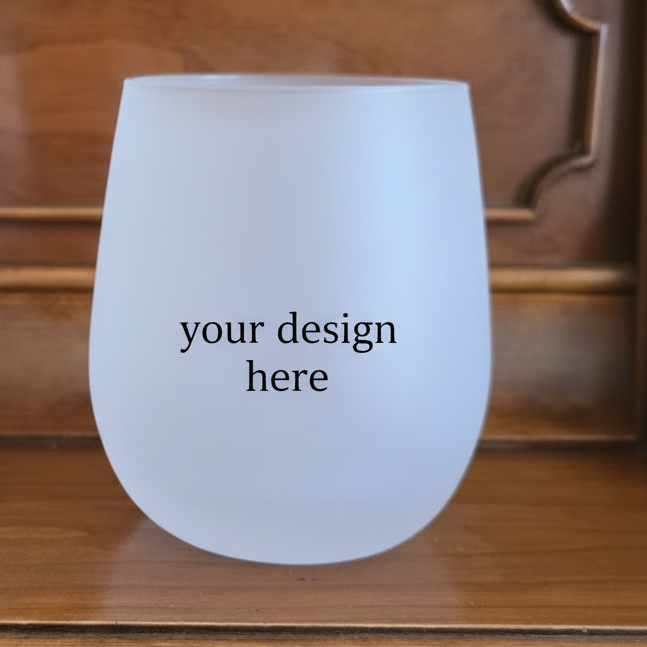 Frosted wine glass with 'your design here' text on a wooden surface