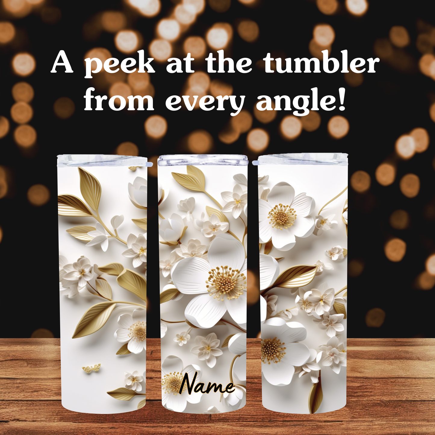 Three floral-patterned tumblers on a wooden surface with a blurred lights background.
