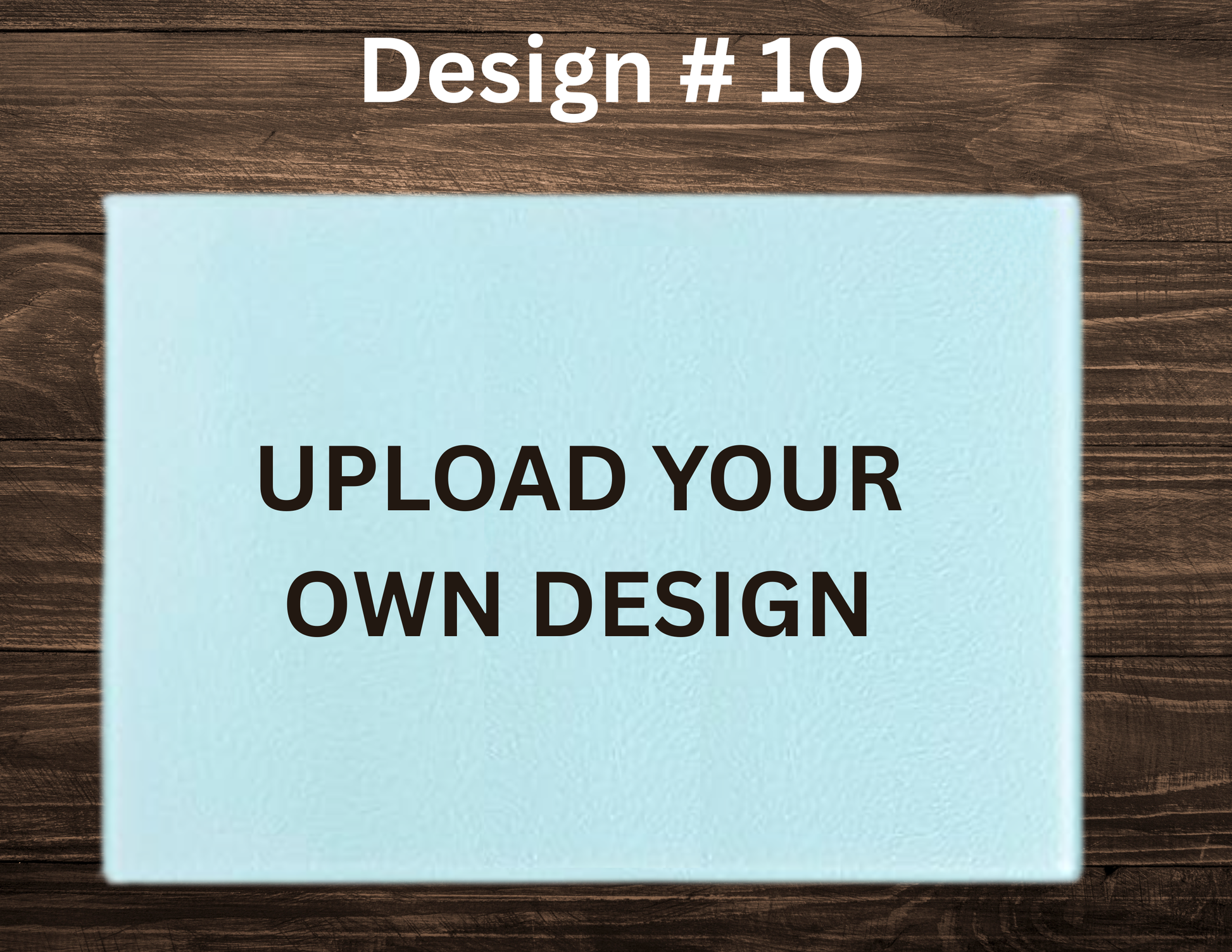 Placeholder design with text 'UPLOAD YOUR OWN DESIGN' on a light blue card against a wooden background.