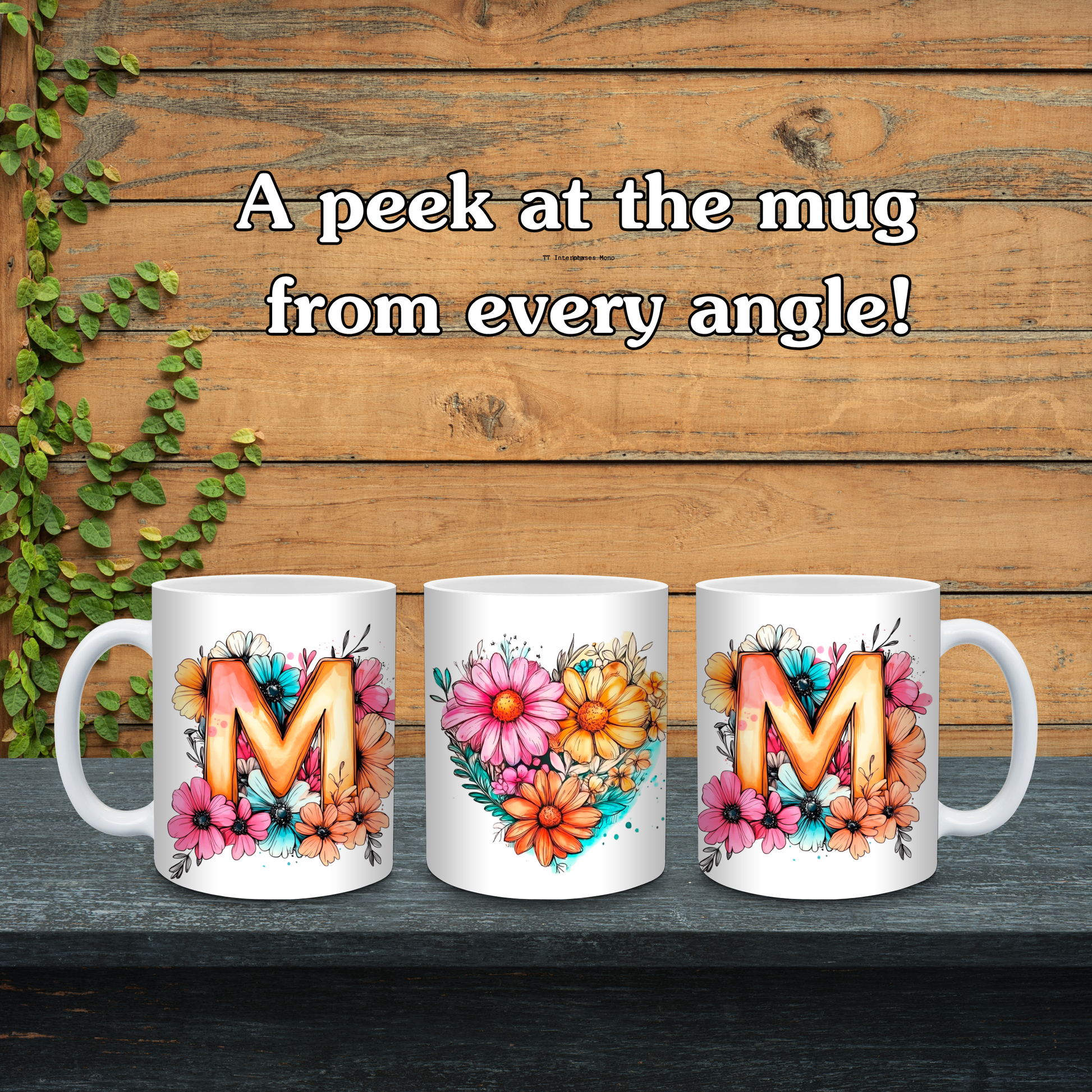 Three white mugs with floral designs and letters 'M' on a wooden background