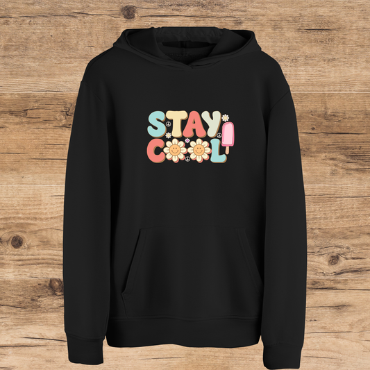 Black hoodie with 'Stay Cool' text on a wooden surface