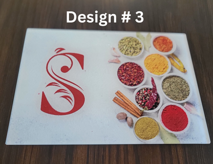 Design #3 with a red logo on a white background, surrounded by small bowls of colorful spices and ingredients.