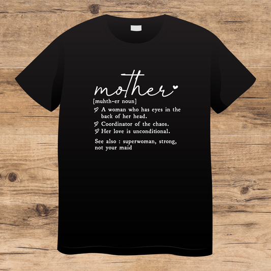 Black t-shirt with white text about mother on a wooden surface