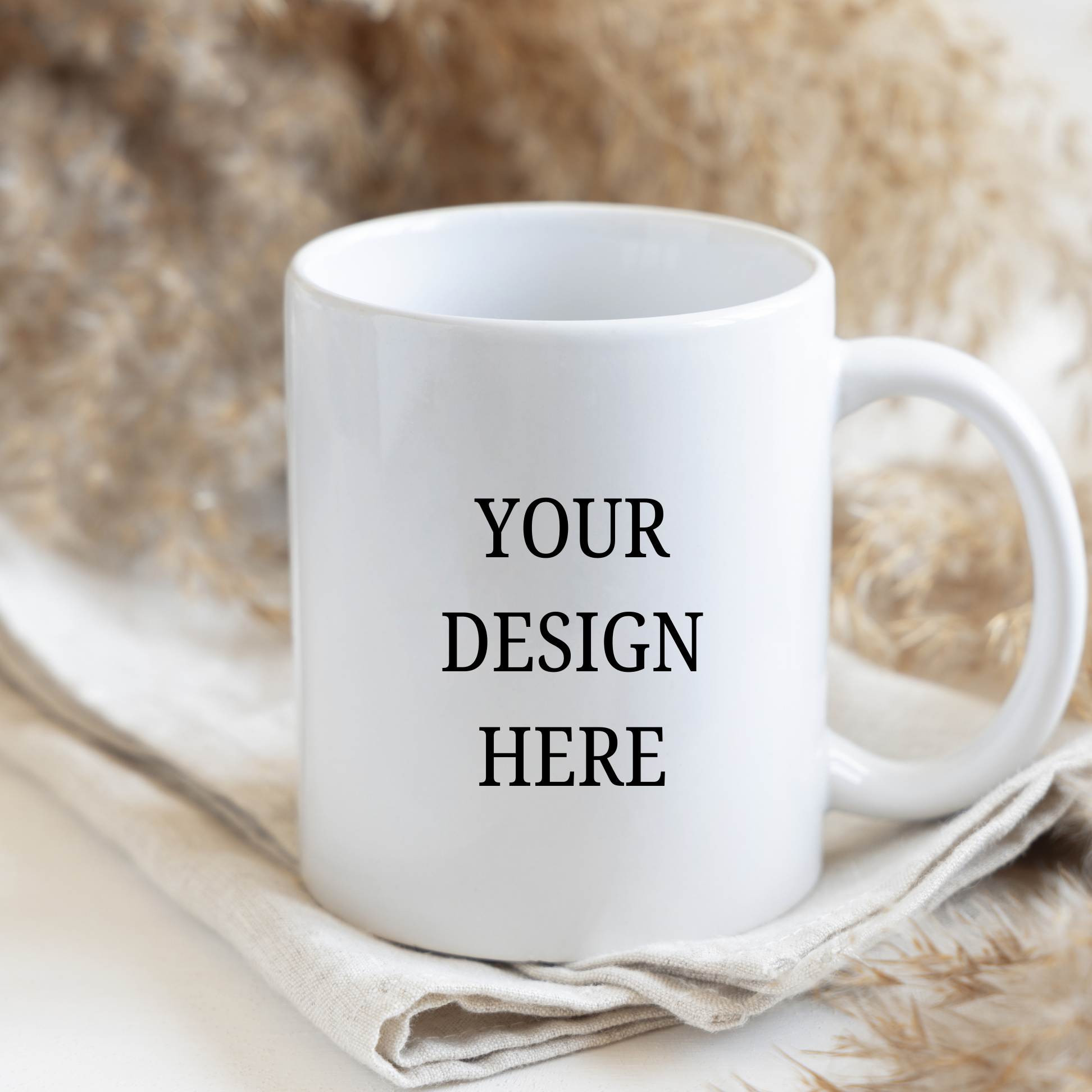 White mug with 'Your Design Here' text on a textured surface