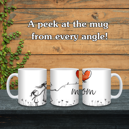Three white mugs with different designs on a wooden surface with text 'A peek at the mug from every angle!'.