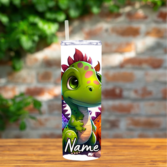 Tumbler with dinosaur design on a wooden surface with a brick wall background