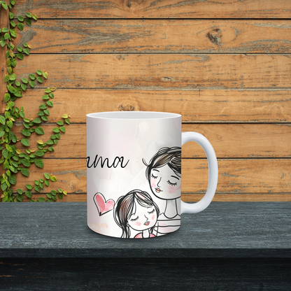 White mug with a design of a mother and daughter on a wooden surface with greenery.