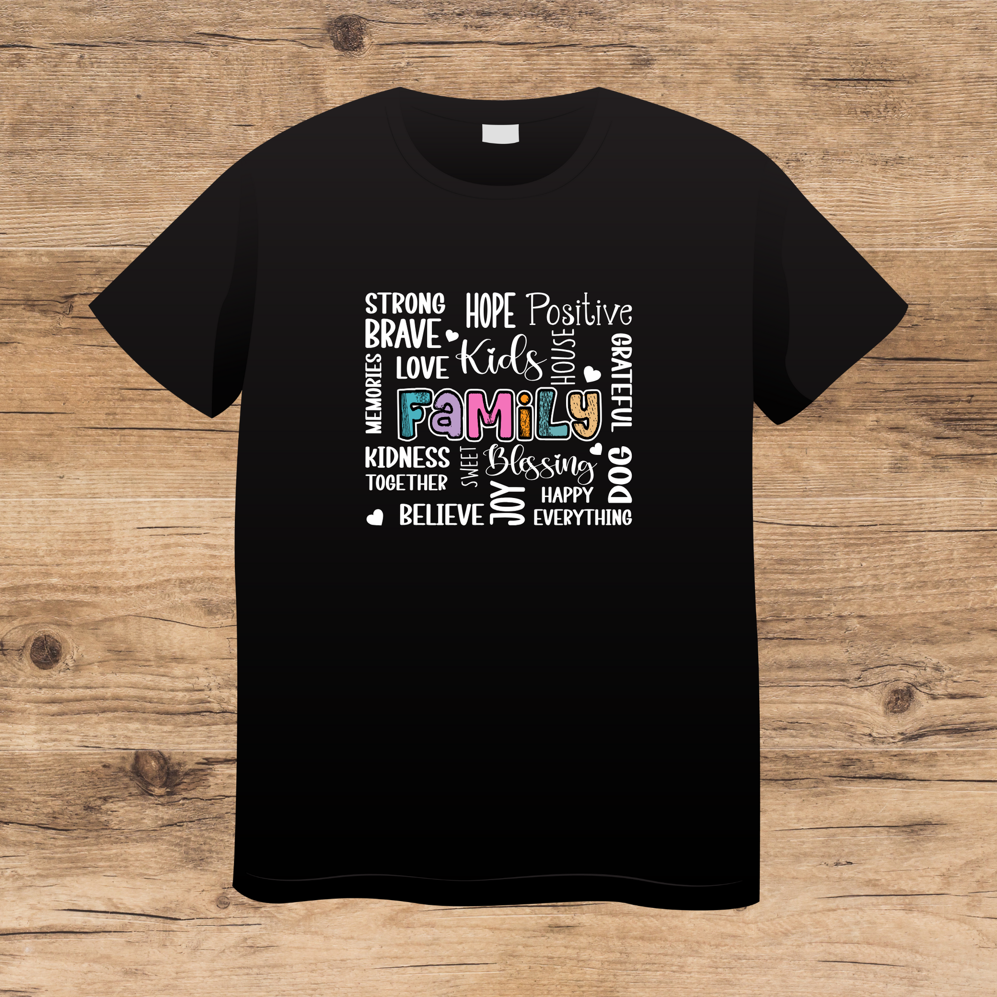 Black t-shirt with motivational text design on a wooden surface