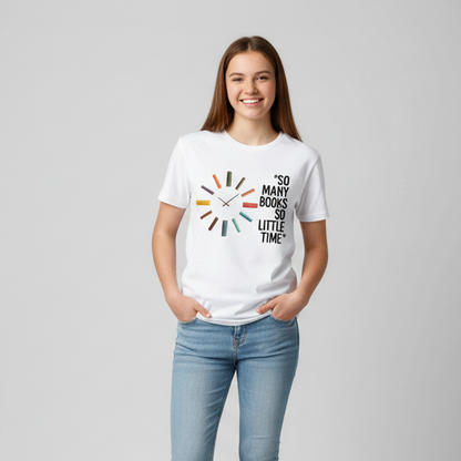 White t-shirt with book-themed design and text on a wooden surface