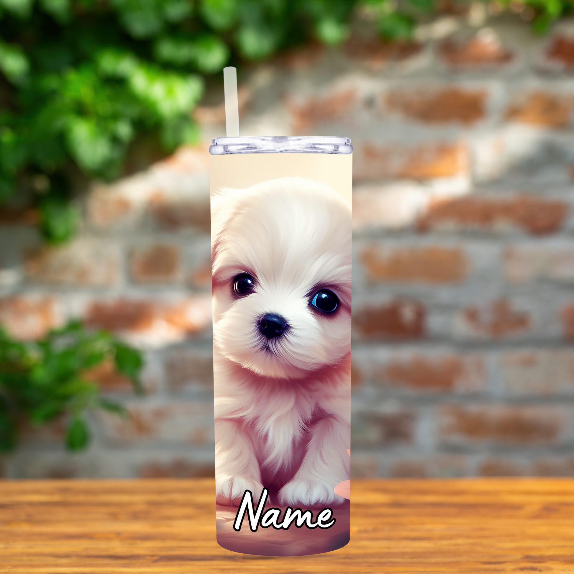 Tumbler with a puppy design on a wooden surface with a brick wall background