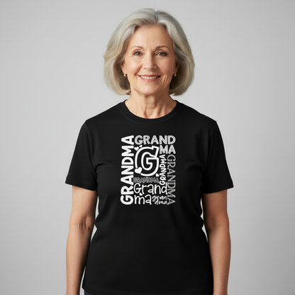 Black t-shirt with 'GRANDMA' text design on a wooden surface