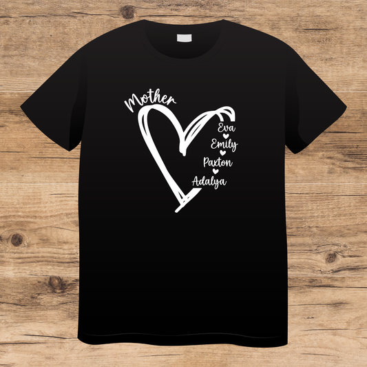 Black t-shirt with white heart design and names on a wooden surface