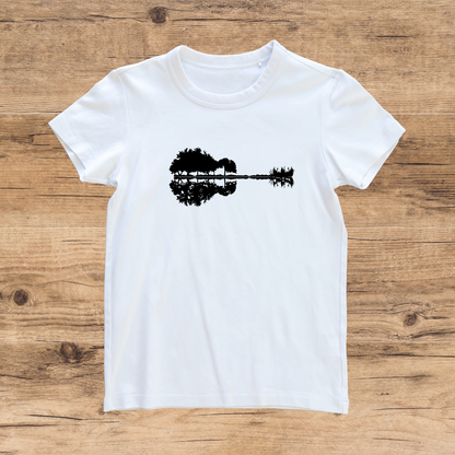 White t-shirt with black graphic on a wooden surface