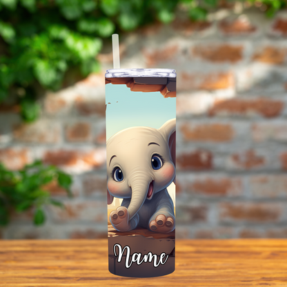 Tumbler with a cartoon elephant design on a wooden surface with a brick wall background