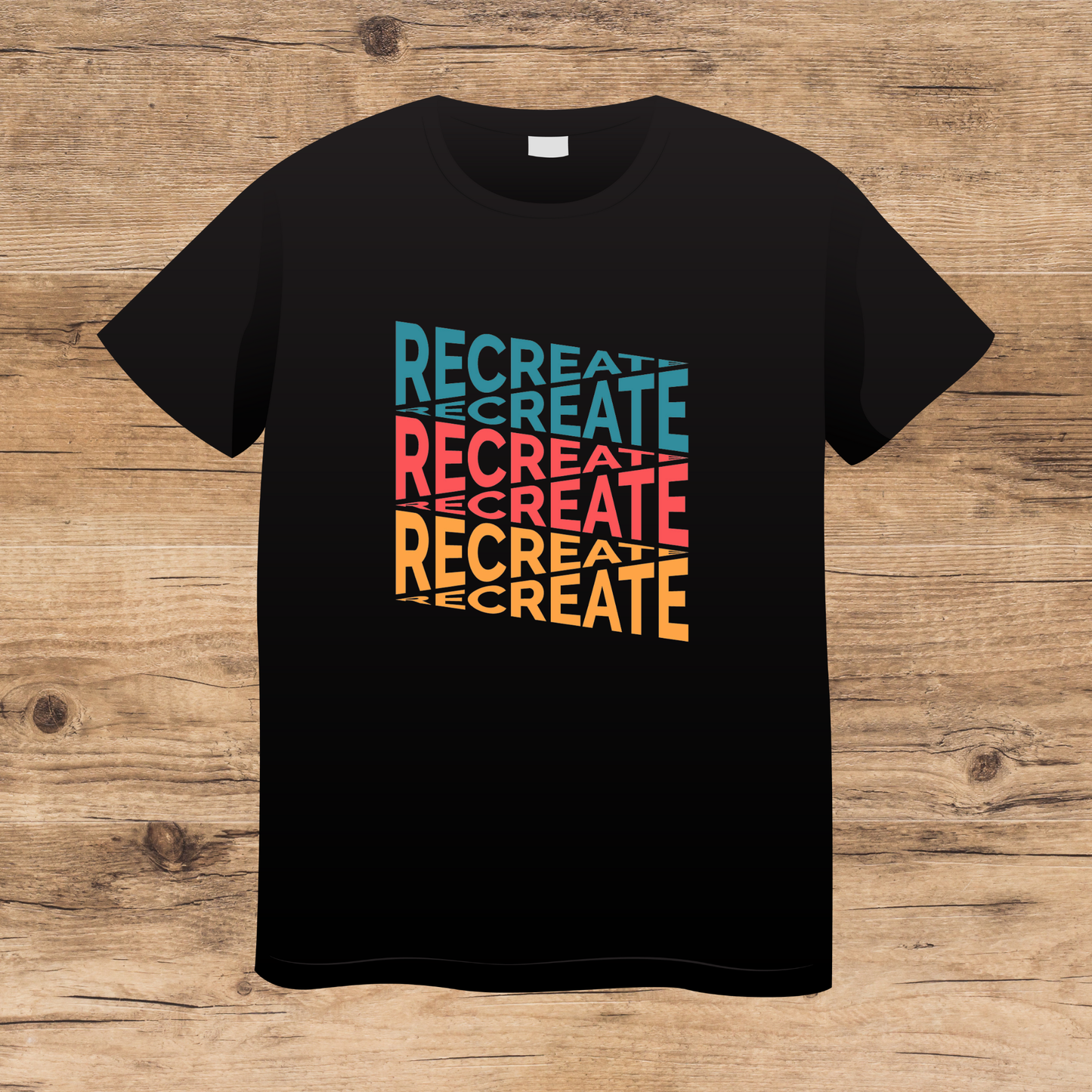 Black t-shirt with 'RECREATE' text in colorful letters on a wooden surface