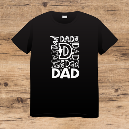 Black t-shirt with 'DAD' text design on a wooden surface