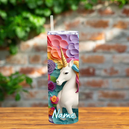 Tumbler with a unicorn design on a wooden surface with a blurred brick wall background