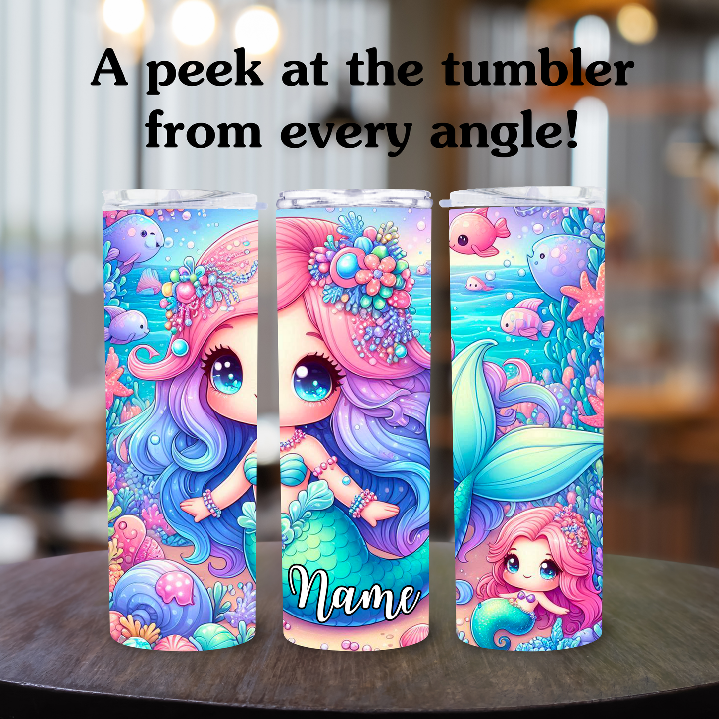 Colorful tumbler with mermaid design and 'Name' text on a wooden surface.