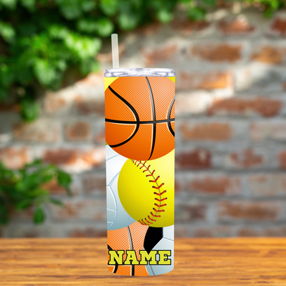 Tumbler with sports ball design on a wooden surface with a brick wall background
