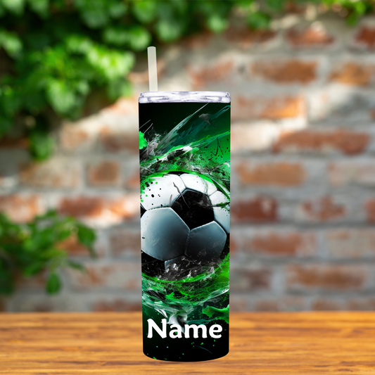 Tumbler with soccer ball design on a wooden surface with a brick wall background