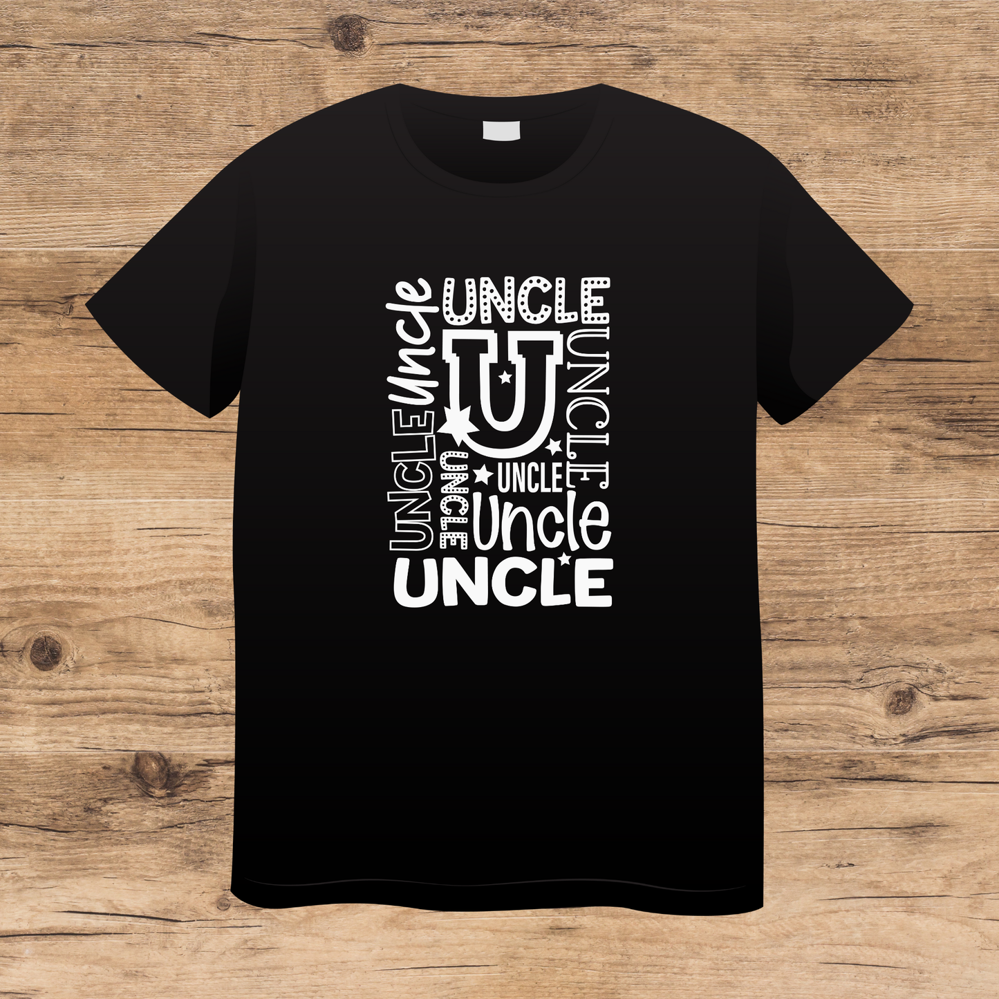 Black t-shirt with 'UNCLE' text design on a wooden surface
