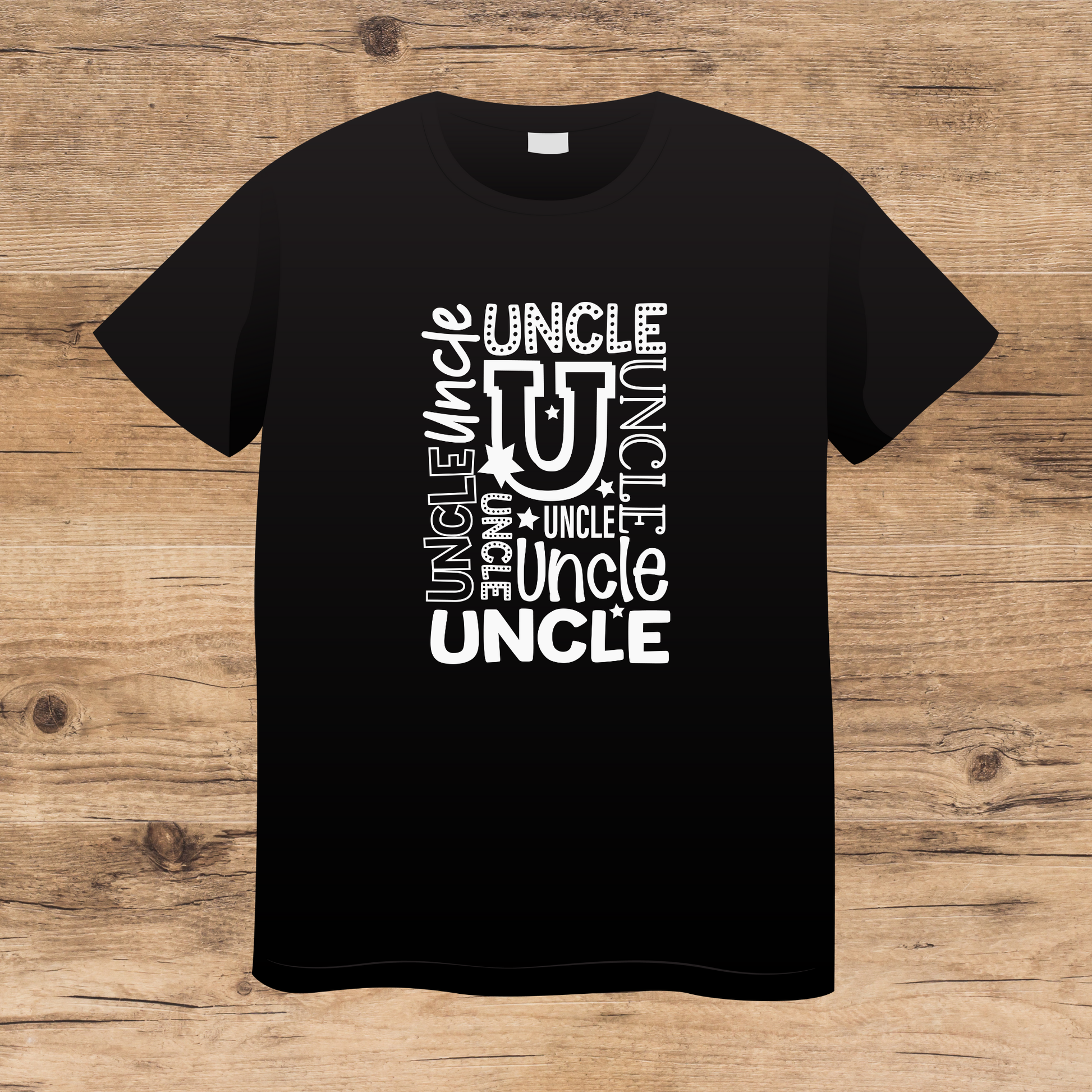 Black t-shirt with 'UNCLE' text design on a wooden surface