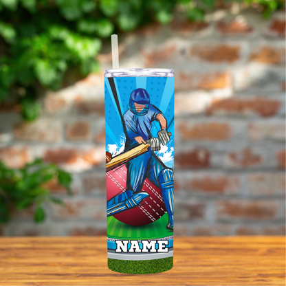 Tumbler with a cricket player design on a wooden surface with a brick wall background