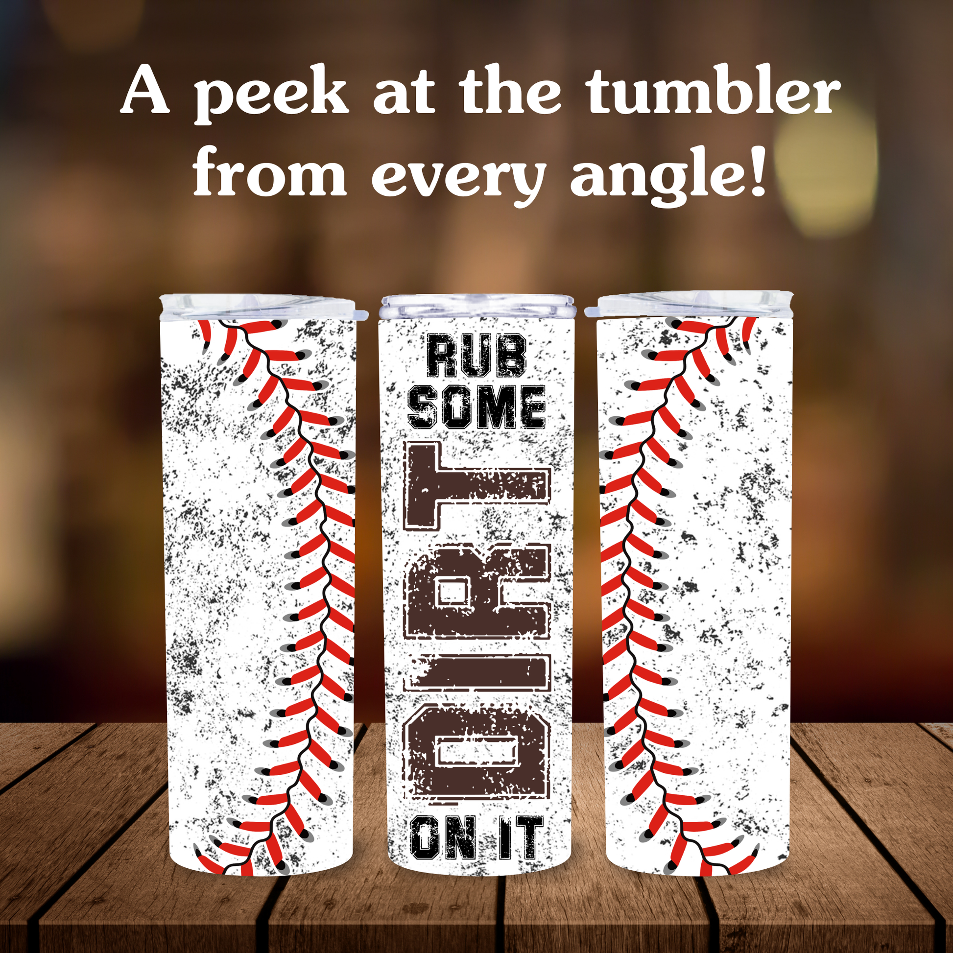 Three tumblers with baseball designs and text on a wooden surface.