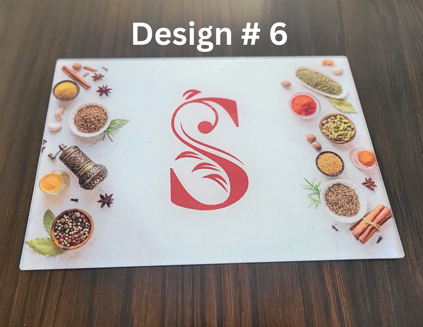 Design #6 with a red letter 'S' surrounded by various spices and ingredients on a white background.