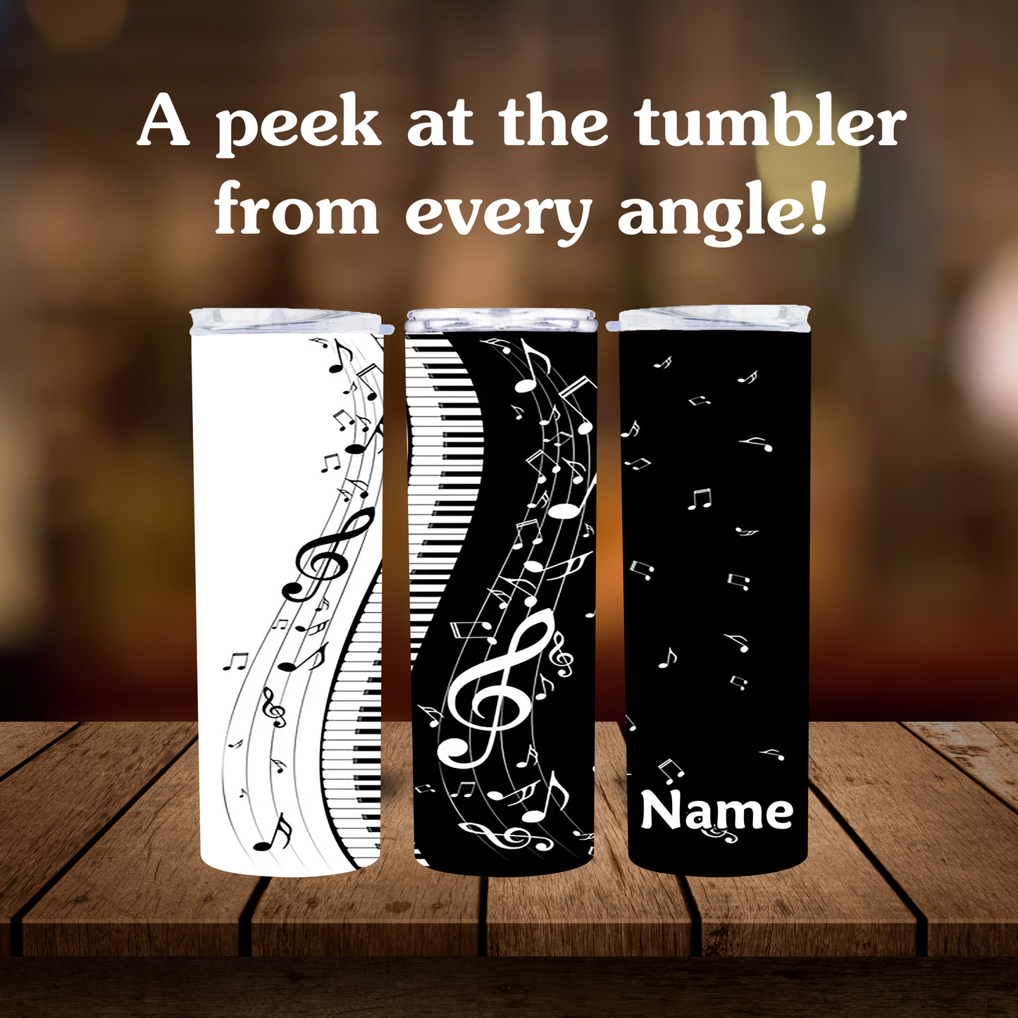 Three tumblers with musical note designs on a wooden surface.