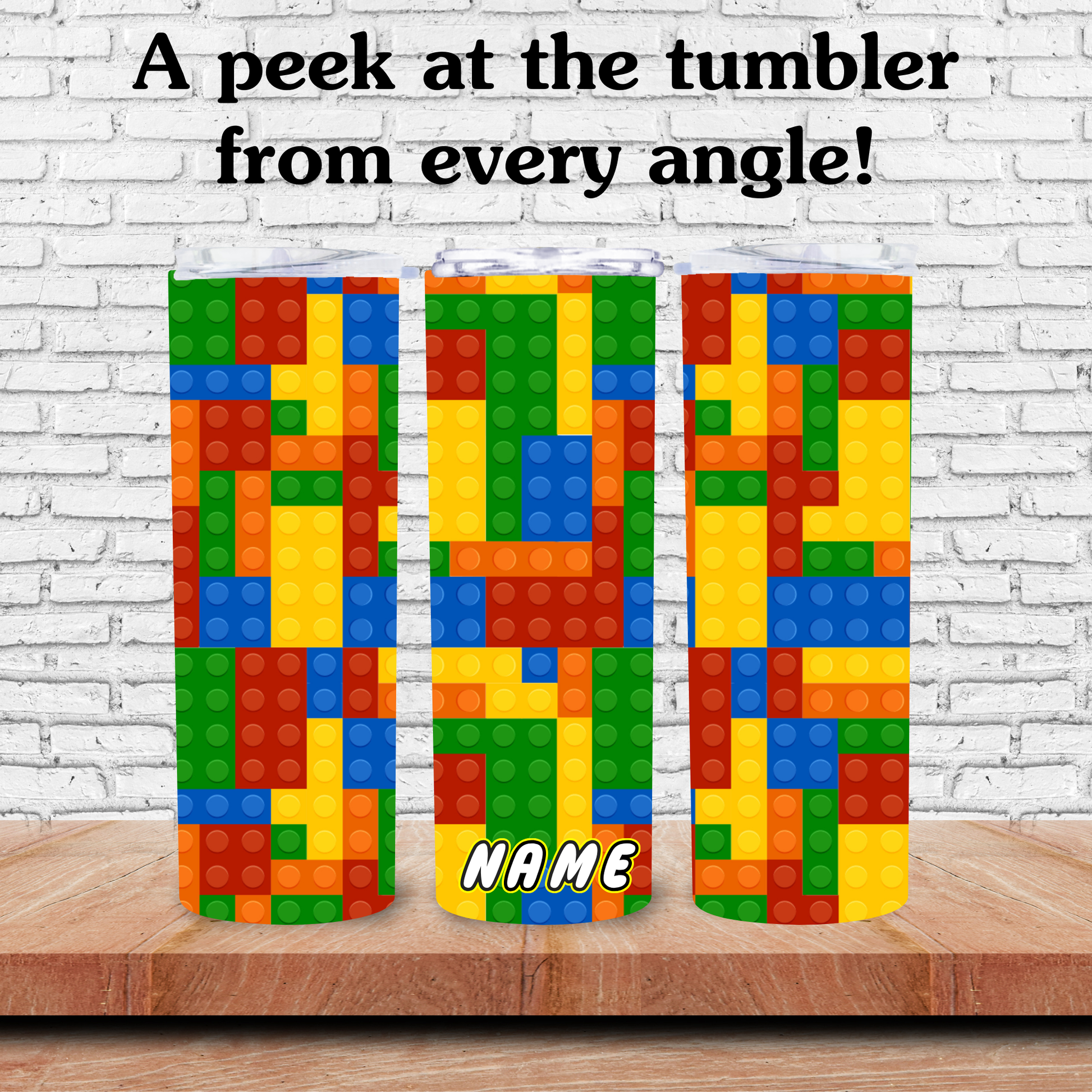 Colorful tumblers with block design on a wooden surface against a white brick wall.