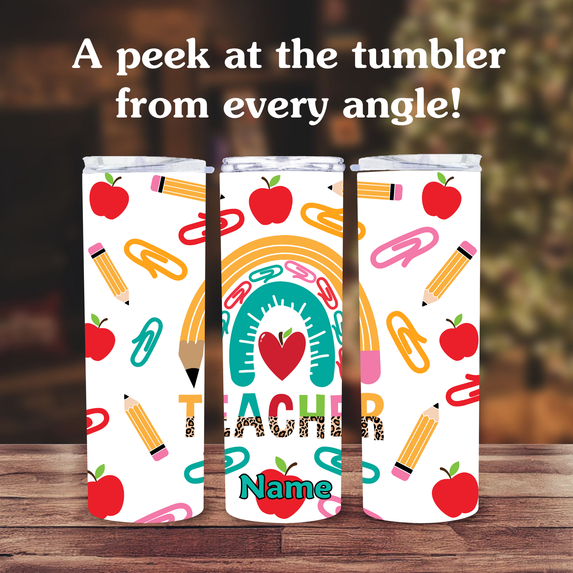 Three tumblers with teacher-themed designs on a wooden surface.