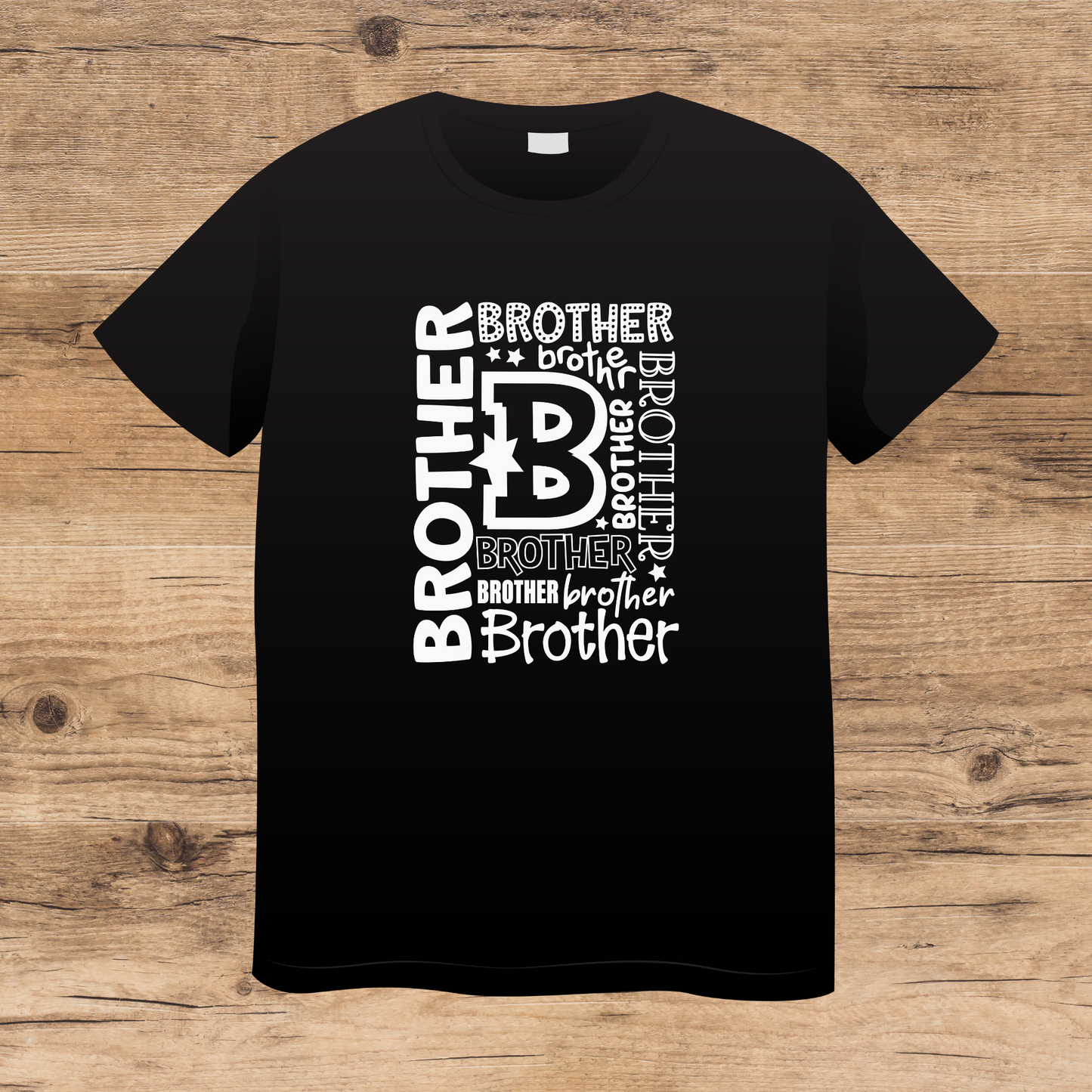 Black t-shirt with 'brother' text design on a wooden surface