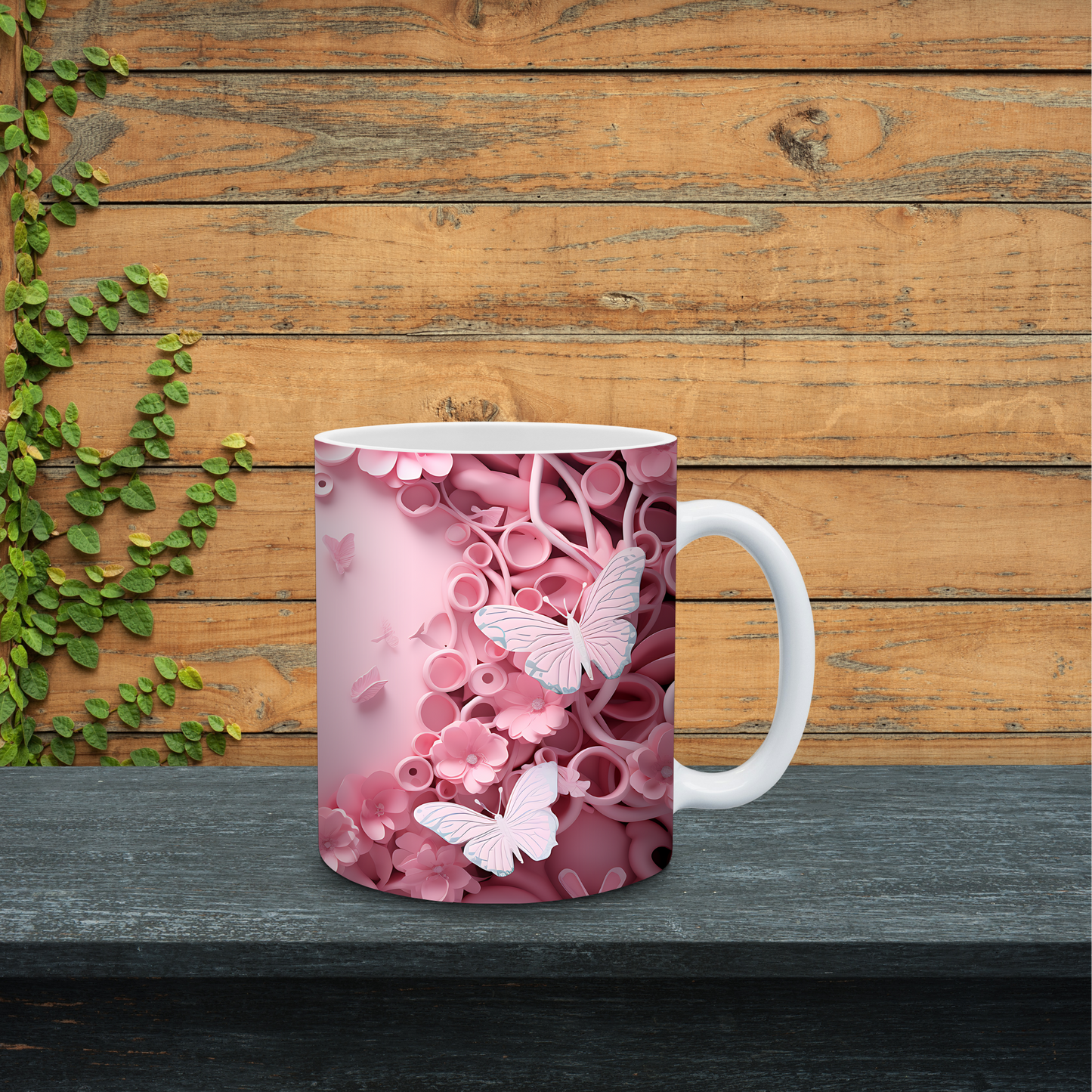 Mug with pink floral and butterfly design on a wooden surface