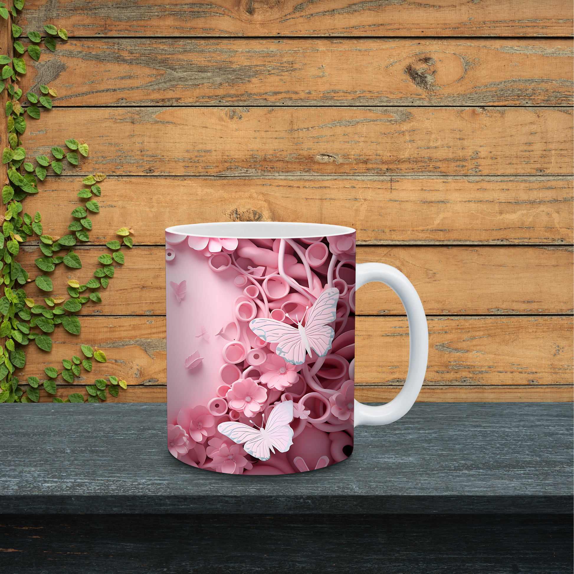 Mug with pink floral and butterfly design on a wooden surface