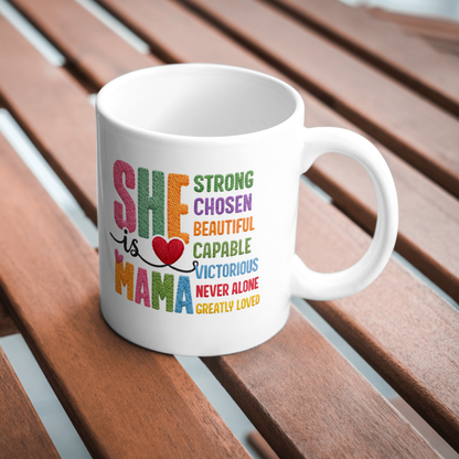 White mug with colorful text on a wooden surface