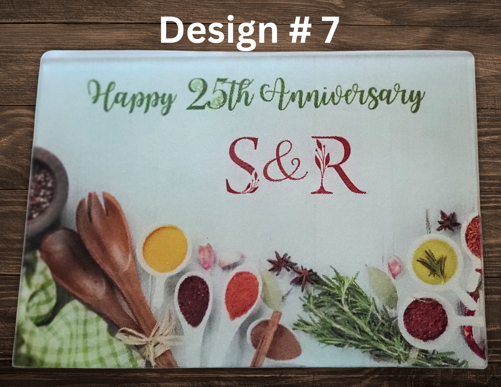 Personalized cutting board with 'Happy 25th Anniversary S&R' text on a wooden surface