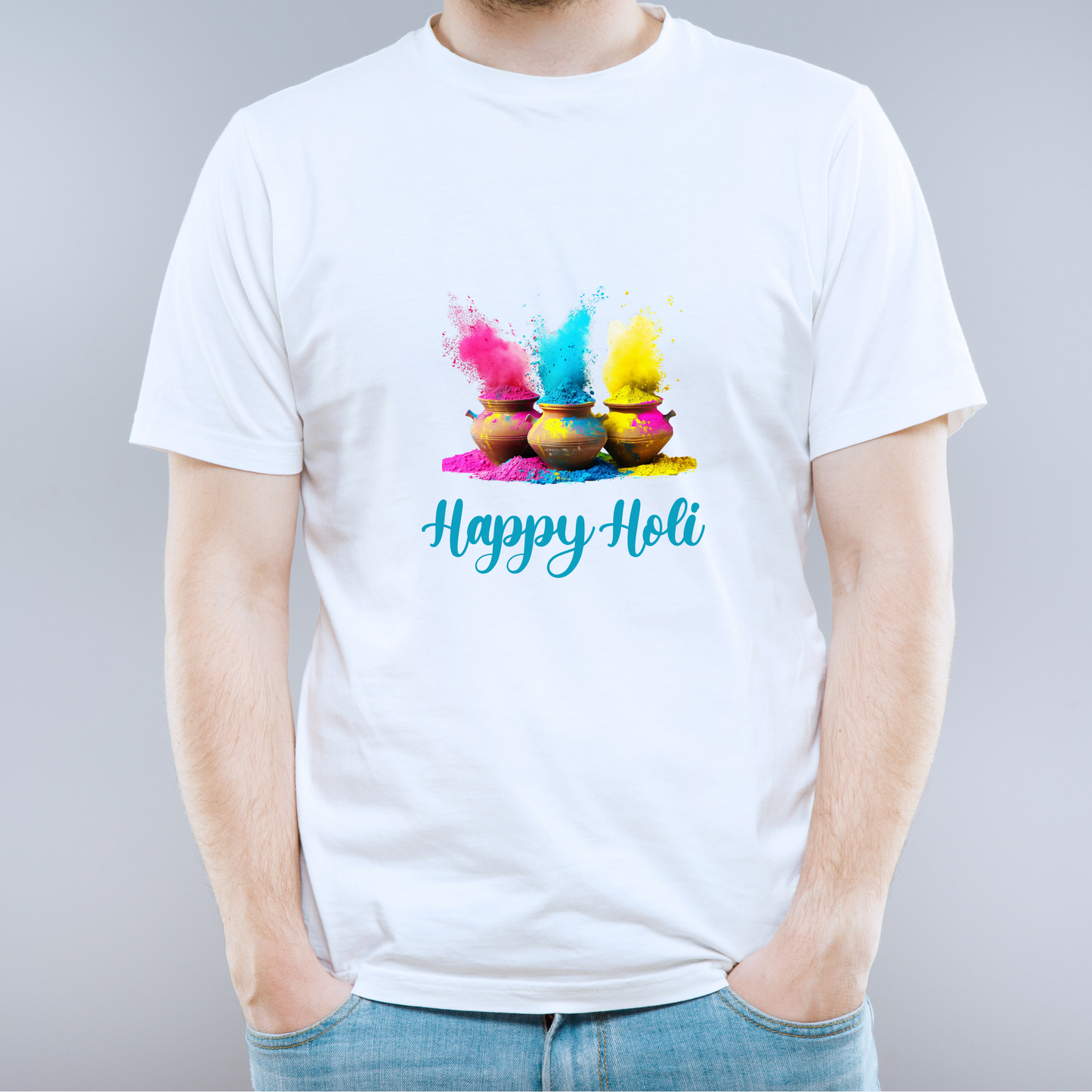 White t-shirt with colorful Holi powder design and 'Happy Holi' text on a gray background
