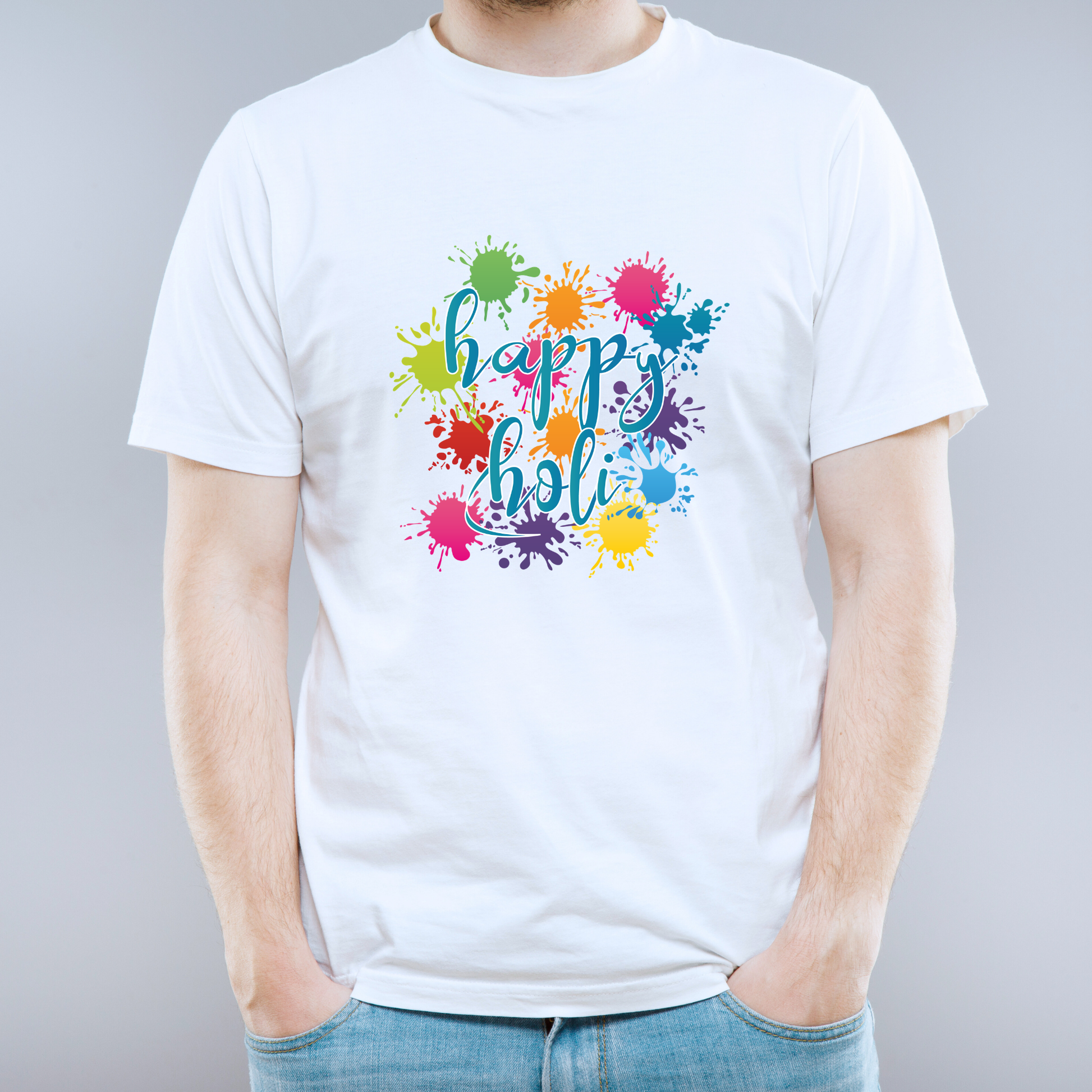 White t-shirt with 'happy holi' colorful design on a gray background