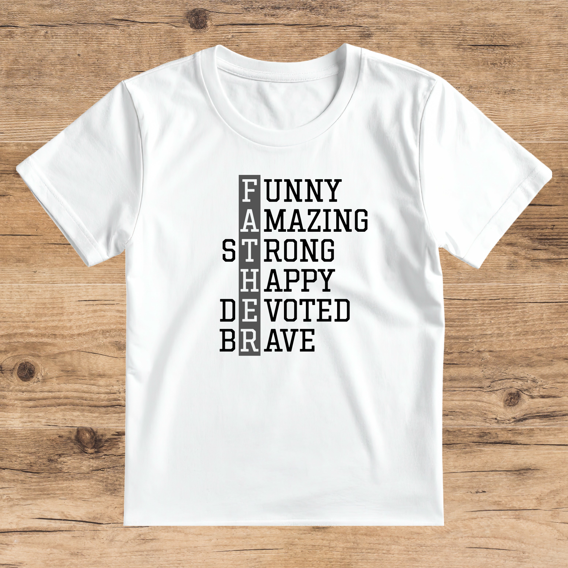White t-shirt with motivational text on a wooden surface