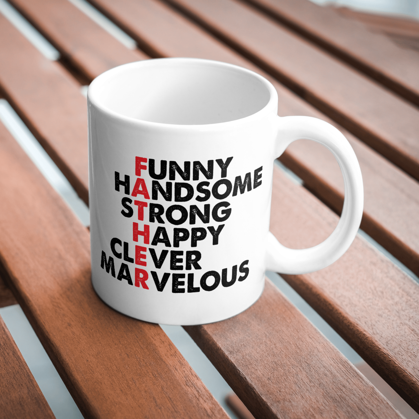 White mug with motivational text on a wooden surface