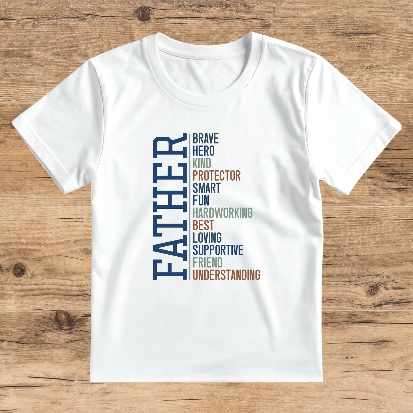 White t-shirt with colorful text on a wooden surface