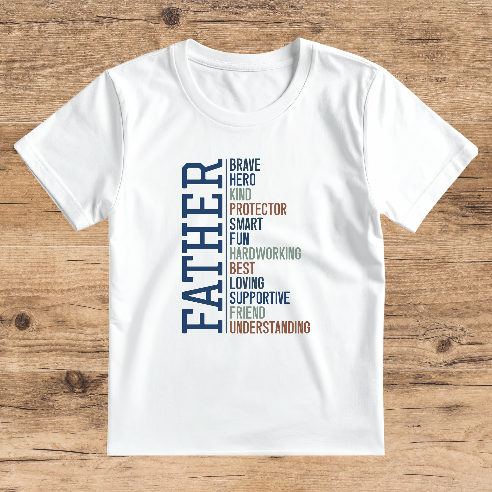 White t-shirt with colorful text on a wooden surface