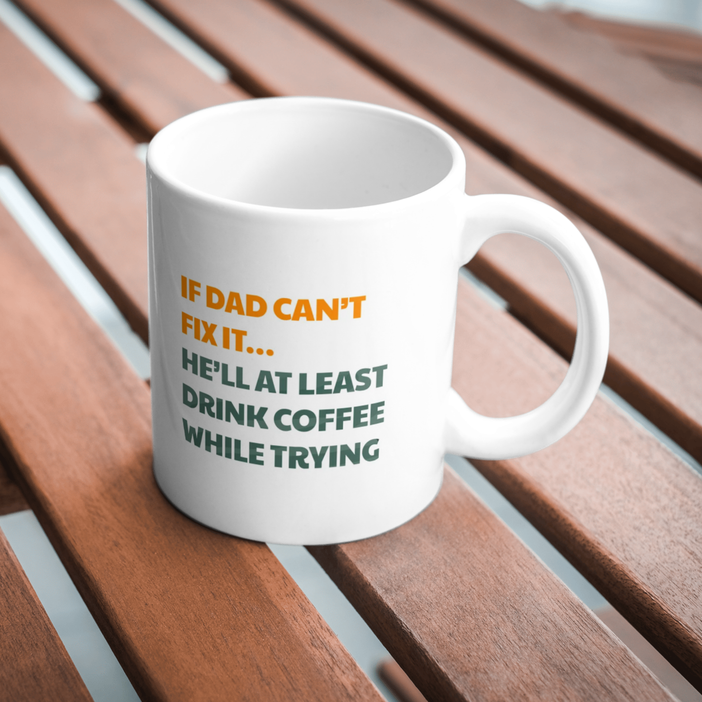 White mug with humorous text on a wooden surface