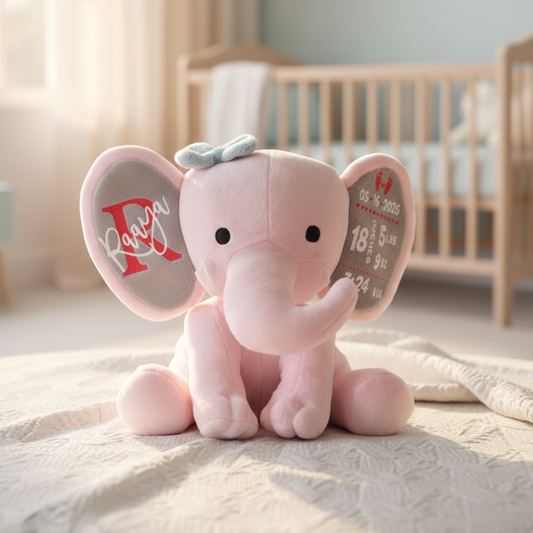 Pink elephant plush toy with personalized details in a nursery setting