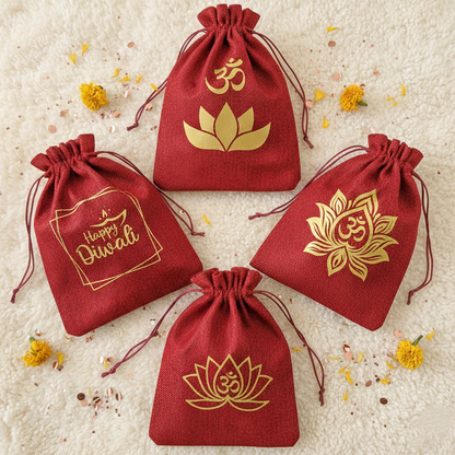 Four red drawstring bags with gold Om and lotus designs on a textured beige background.