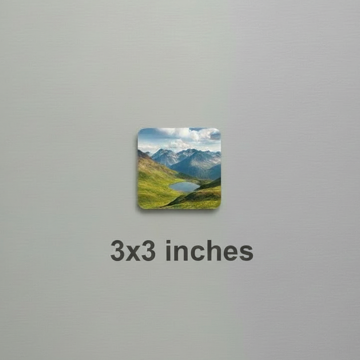 Fridge magnet with a mountain landscape on a metallic refrigerator